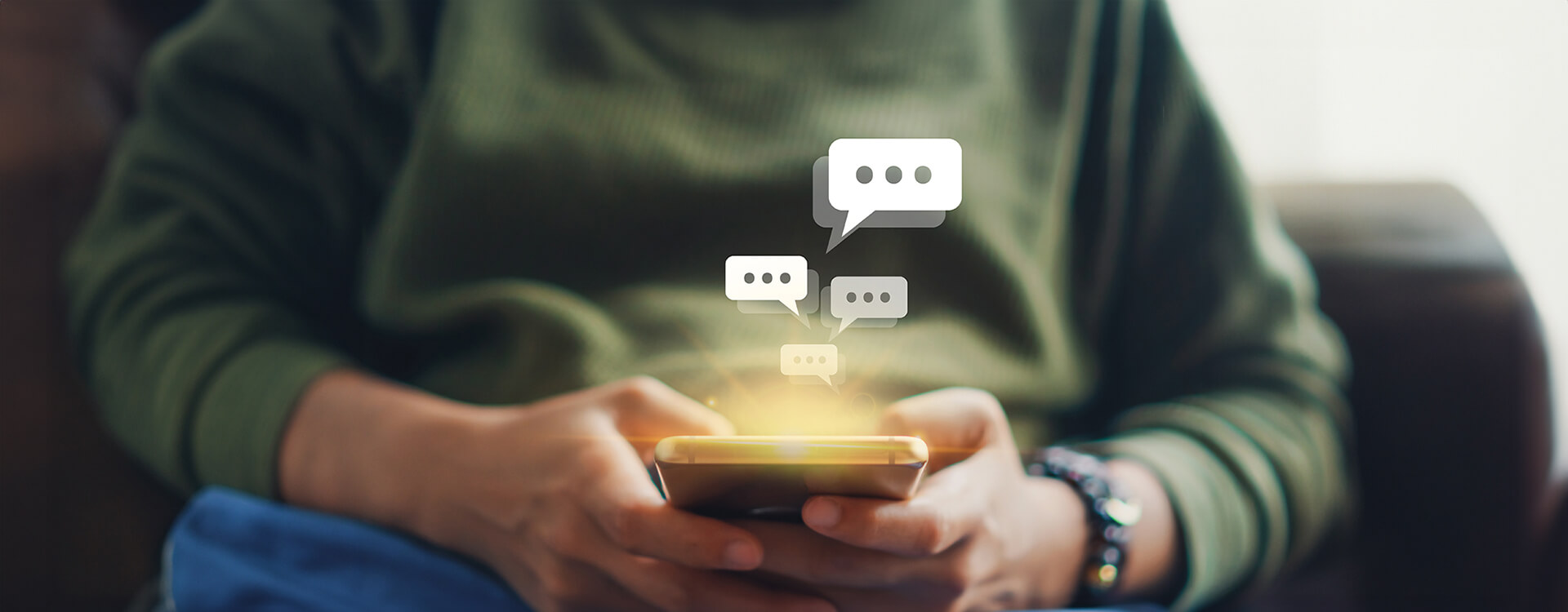 Women hand using smartphone typing, chatting conversation in chat box icons pop up. Social media maketing concept. 